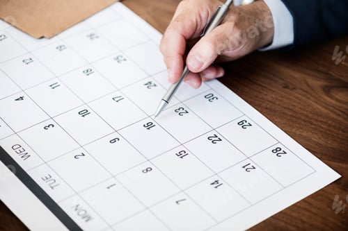 Preview: Businessman marking on calendar for an appointment