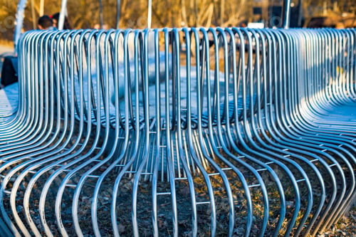 Preview: Close-up street bench metal pipes arranged parallel