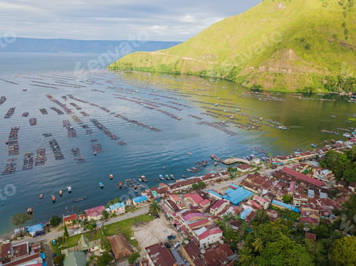 Preview: Aerial drone shot of Batak Village by Toba Lake at Haranggaol in Sumatra Utara, Indonesia