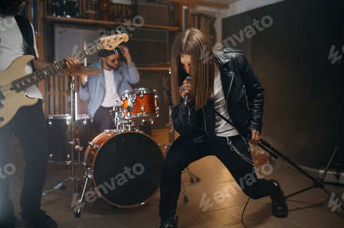 Preview: Expressive rocker singing in microphone while his band playing heavy metal
