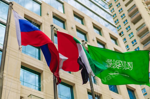 Preview: United Arab Emirates and Russia flag waving against building