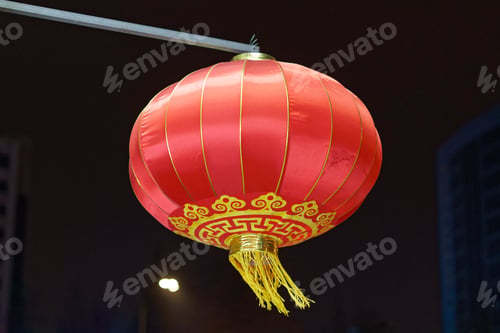 Preview: Closeup shot of a red Chinese traditional lamp on a black background