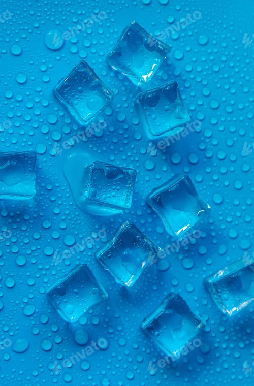 Preview: Ice cubes on a blue background. Selective focus.
