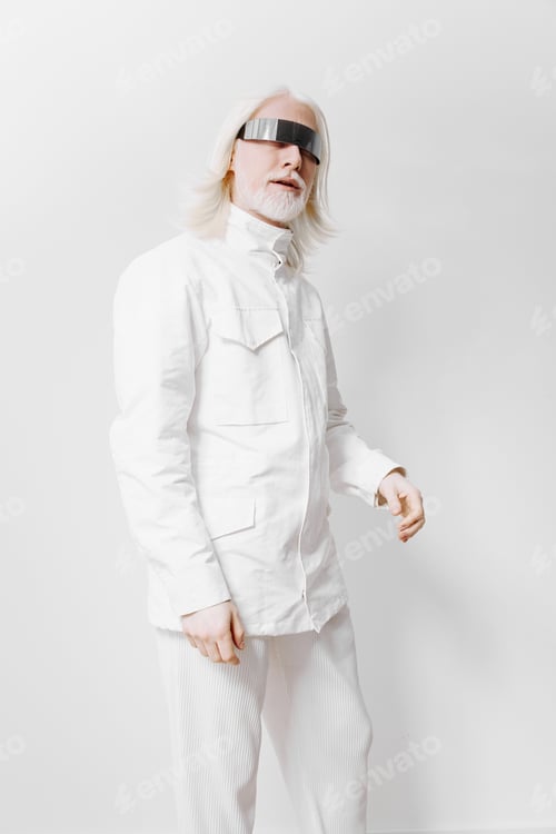 Preview: Stylish man in futuristic attire, wearing a white jacket and pants with a unique visor, standing