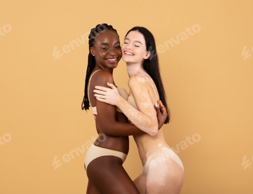 Preview: Two attractive females with different skin and body types posing in underwear