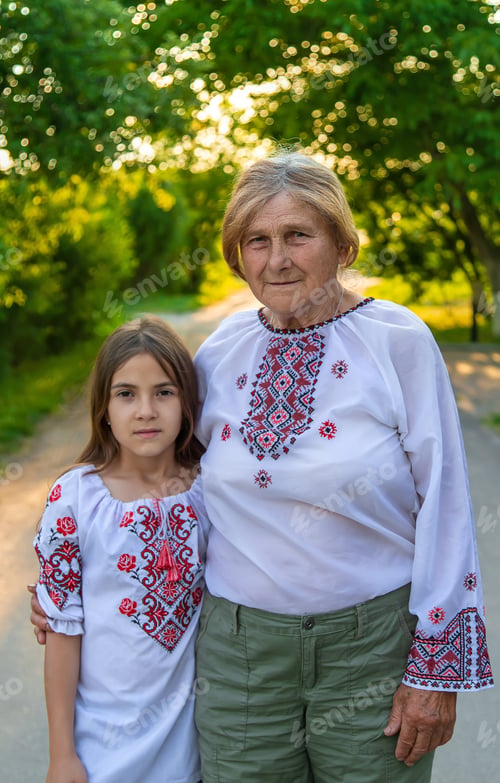 Preview: Ukrainian grandmother and granddaughter in vyshyvanka. selective focus.