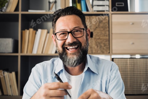 Preview: Portrait of one happy cheerful artist man looking at the camera taking inspiration to draw
