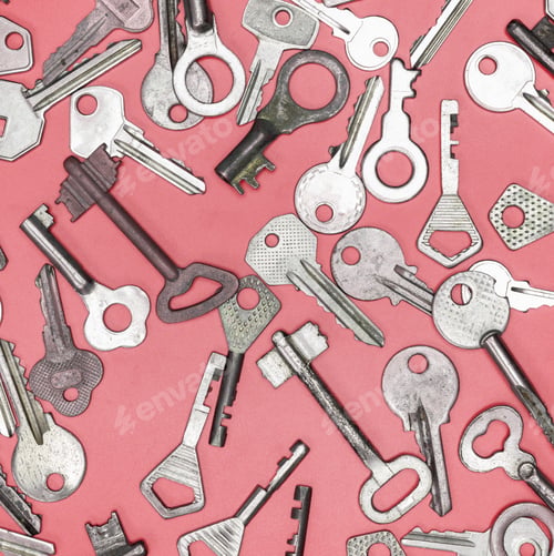 Preview: Keys set on pink background. Door lock keys and safes for proper
