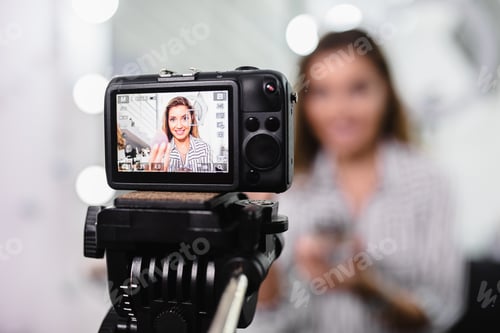Preview: Young female blogger making a video for her beauty blog on cosmetics.