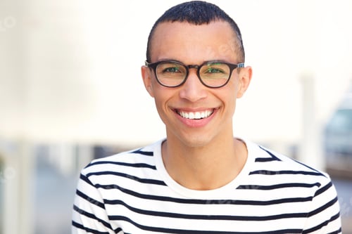 Preview: Close up happy young man with glasses