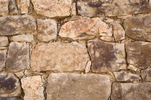 Preview: Masonry walls of natural sand color. Stone texture close-up, construction and mining background.