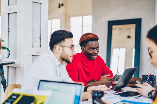 Preview: Millennial hipster guys discussing startup while brainstorming