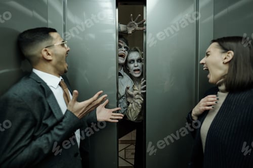 Preview: Young contemporary thrilled office managers in formalwear shouting in horror in moving elevator