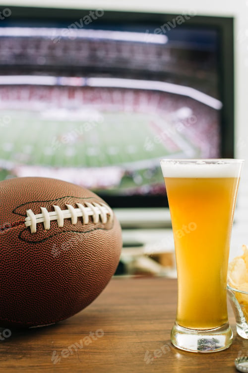 Preview: Beer and snacks prepared for watching american football on TV