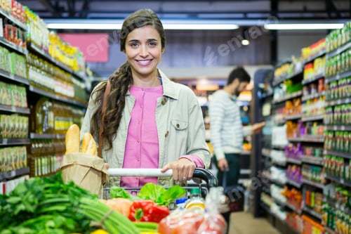 Preview: Portrait of woman with vegetables in shopping trolley
