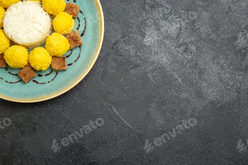 Preview: top view delicious dessert little yellow candies with cake inside plate on grey background candy tea