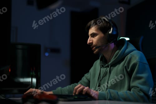 Preview: Male cybersport gamer playing computer game