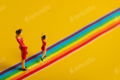 Preview: little mother and daughter figures on the LGBT rainbow path