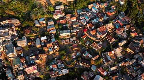 Preview: Aerial view of Antananarivo at sunset showcasing colorful rooftops and vibrant urban life