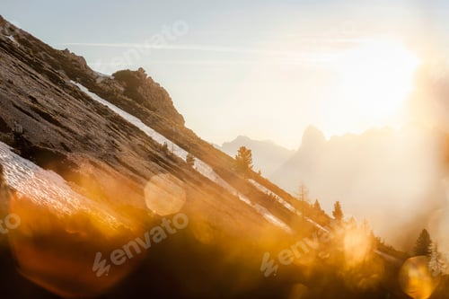Preview: Sunset over a serene mountain landscape