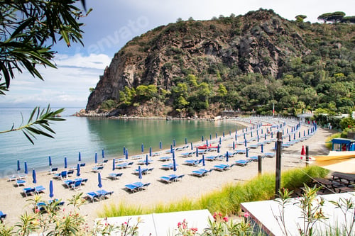 Preview: beautiful beach with chairs and umbrellas