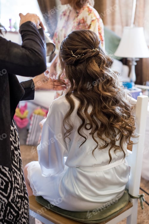 Preview: Wedding preparations for this bride includes a hairstylist before the ceremony begins
