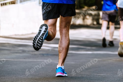 Preview: close-up sole of running shoe male runner, summer marathon race