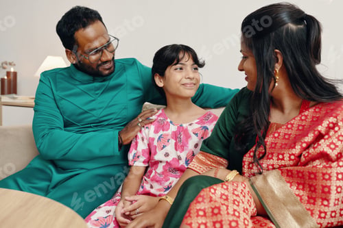 Preview: Smiling Family Celebrating Festive Occasion Indoors