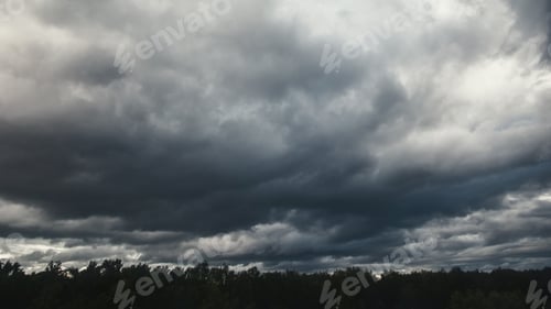 Preview: Heavy dark low clouds over forest before thunderstorm