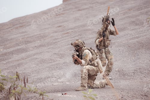 Preview: Soldiers in camouflage military uniforms carrying weapons Reconnaissance missions in rugged mountain