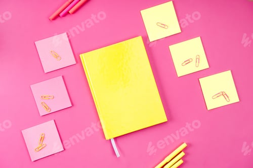 Preview: top view of various colorful appliances on pink