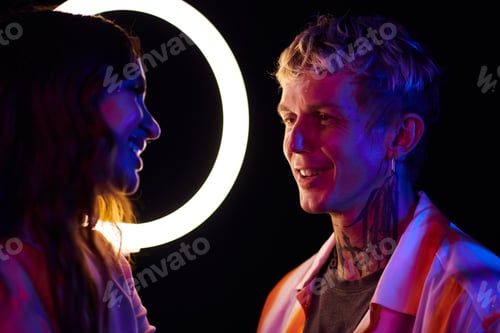 Preview: Man Talking to Girl at Night Party