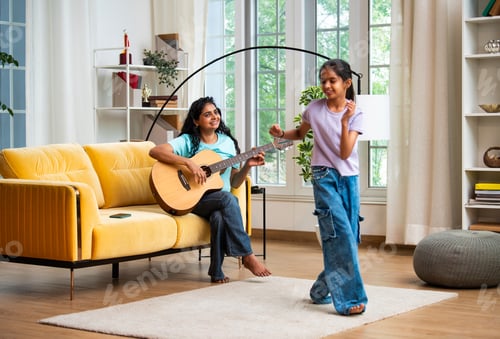 Preview: Asian mother and daughter enjoy music time together, dancing and playing guitar at home