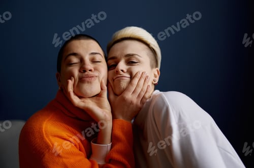 Preview: Two Young Adults Making Silly Faces Together Indoors