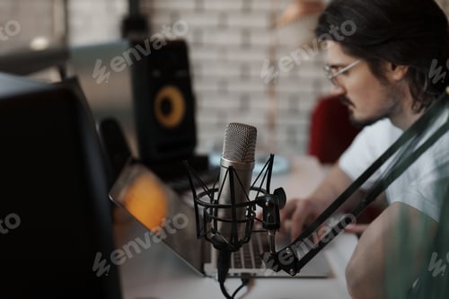 Preview: Concentrated man working in recording studio