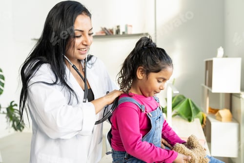 Preview: female doctor Hispanic pediatrician auscultating a small child - health concept -