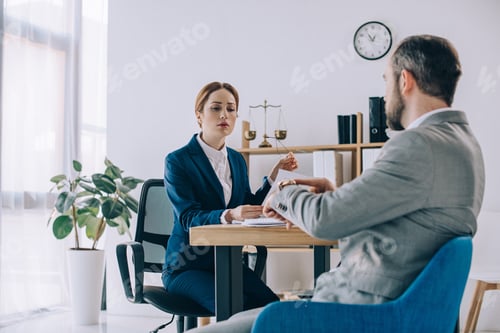 Preview: lawyers having meeting at workplace in office
