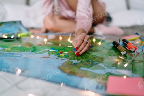 Preview: Girl pointing with notice board pins on Russia map