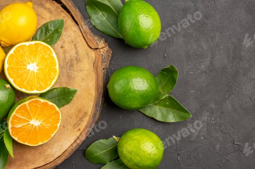 Preview: top view fresh lemons on dark background lime sour fruits citrus