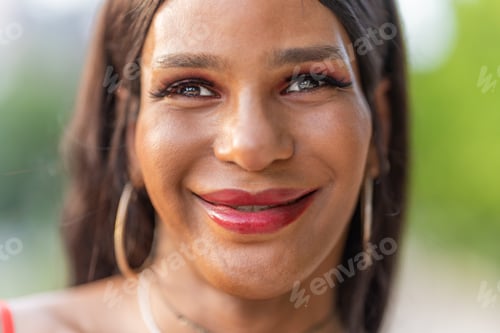 Preview: Close up portrait of a happy transsexual woman smiling at the camera