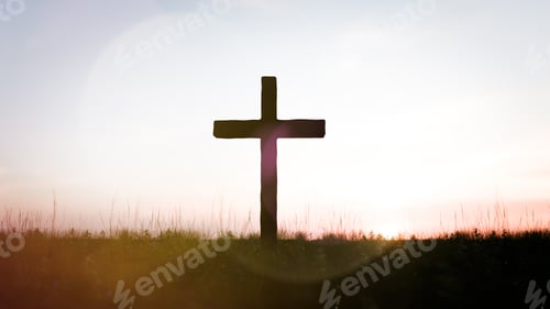 Preview: Silhouette of a cross against a sunset sky