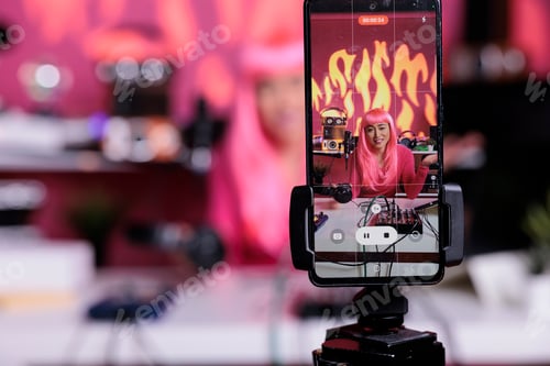 Preview: Influencer recording podcast using professional vlogging equipment while standing in streaming