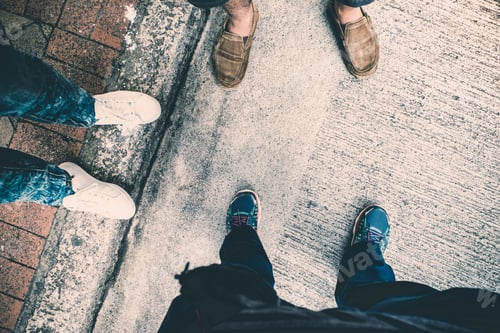Preview: Aerial view of group of teenager feet standing on concrete street,Urban lifestyle