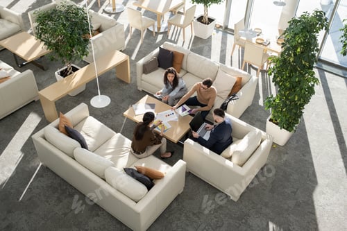 Preview: Group of young auditors of high tech corporation discussing documents