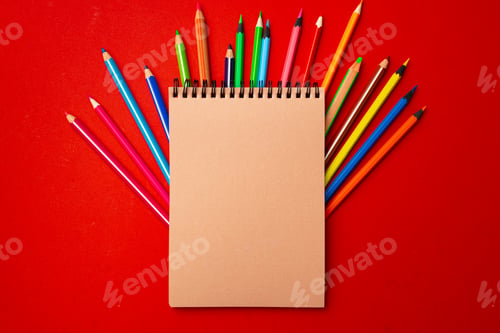 Preview: Notepad and color pencils on working space top view
