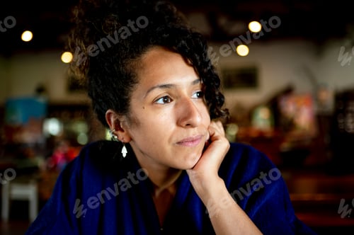 Preview: Mixed race woman looking away at morning.