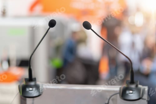 Preview: Empty stage with a microphone awaits the next tech visionary at a Technology Trade Show
