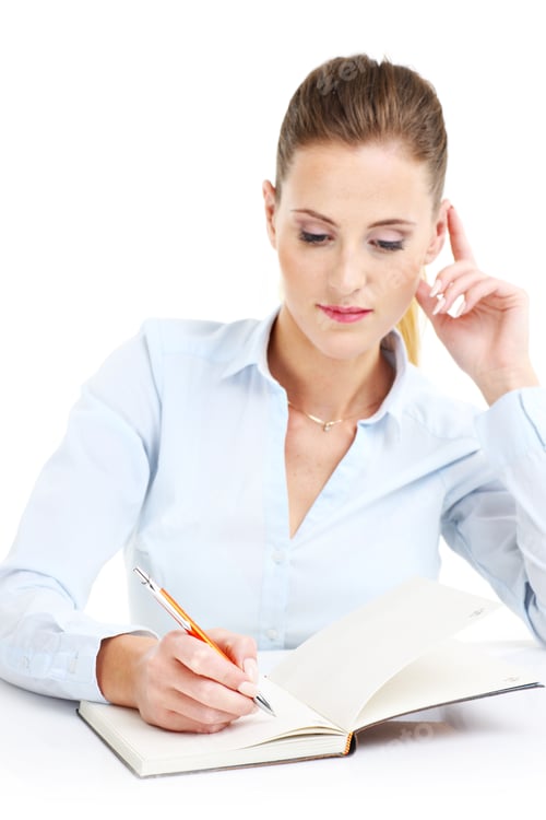 Preview: Professional Woman Taking Notes in a Bright Office