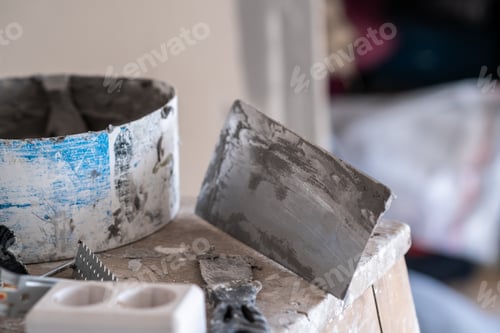 Preview: Applying decorative putty. White abstract texture of surface covered with putty