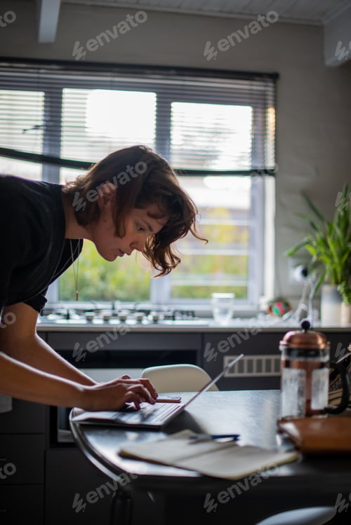 Preview: Adult Working from Home with a Laptop